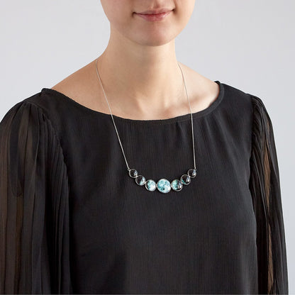 Varying Sized Curved Moon Phase Necklace in Silver