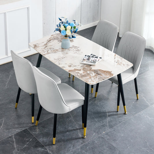 Table and chair set.48.4*28 Inch White Sintered Stone Dining Table Set - 4 Light Gray chairs with PU cushions and black metal legs.