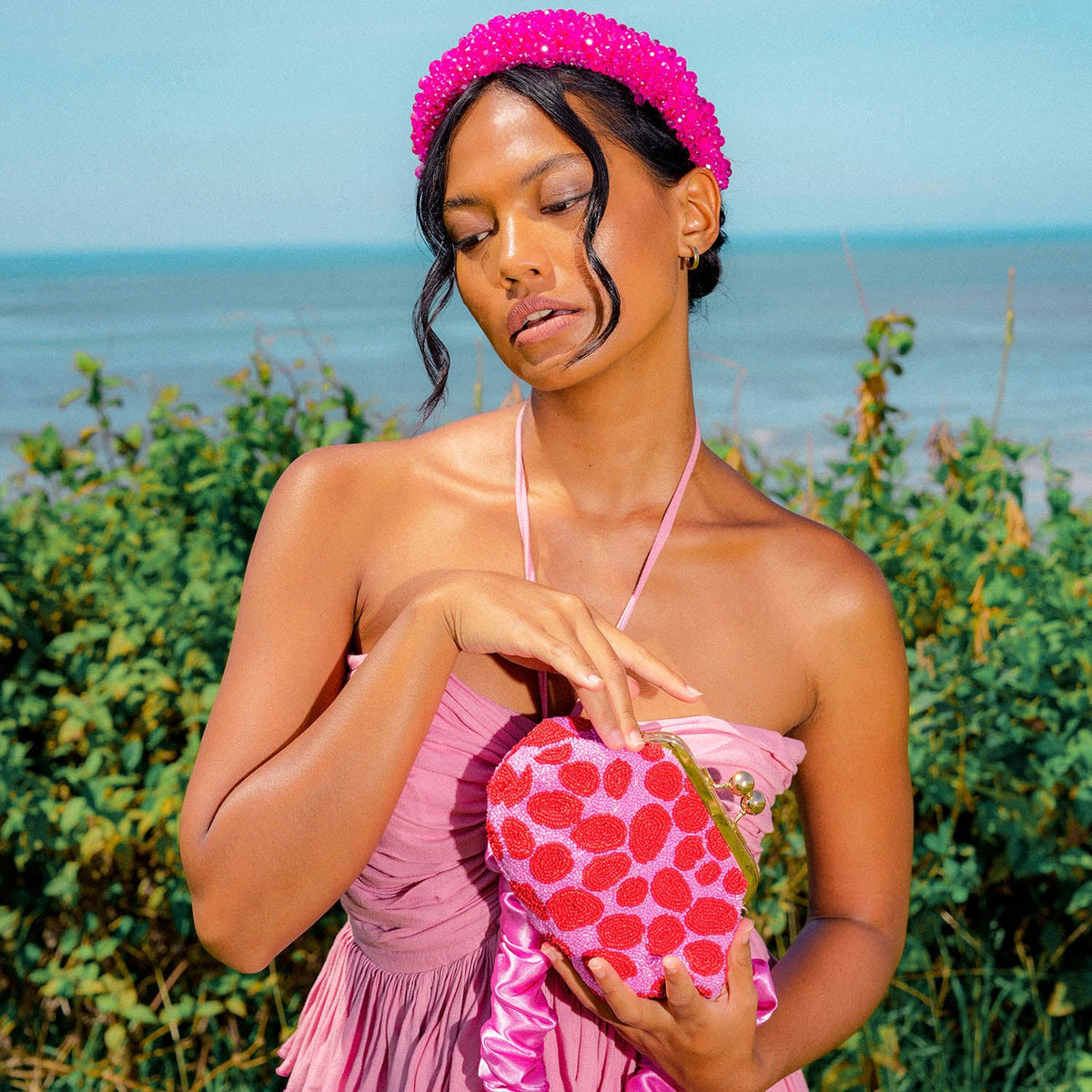 The Arnoldi Daisy Hand-Beaded Clutch in Pink & Red