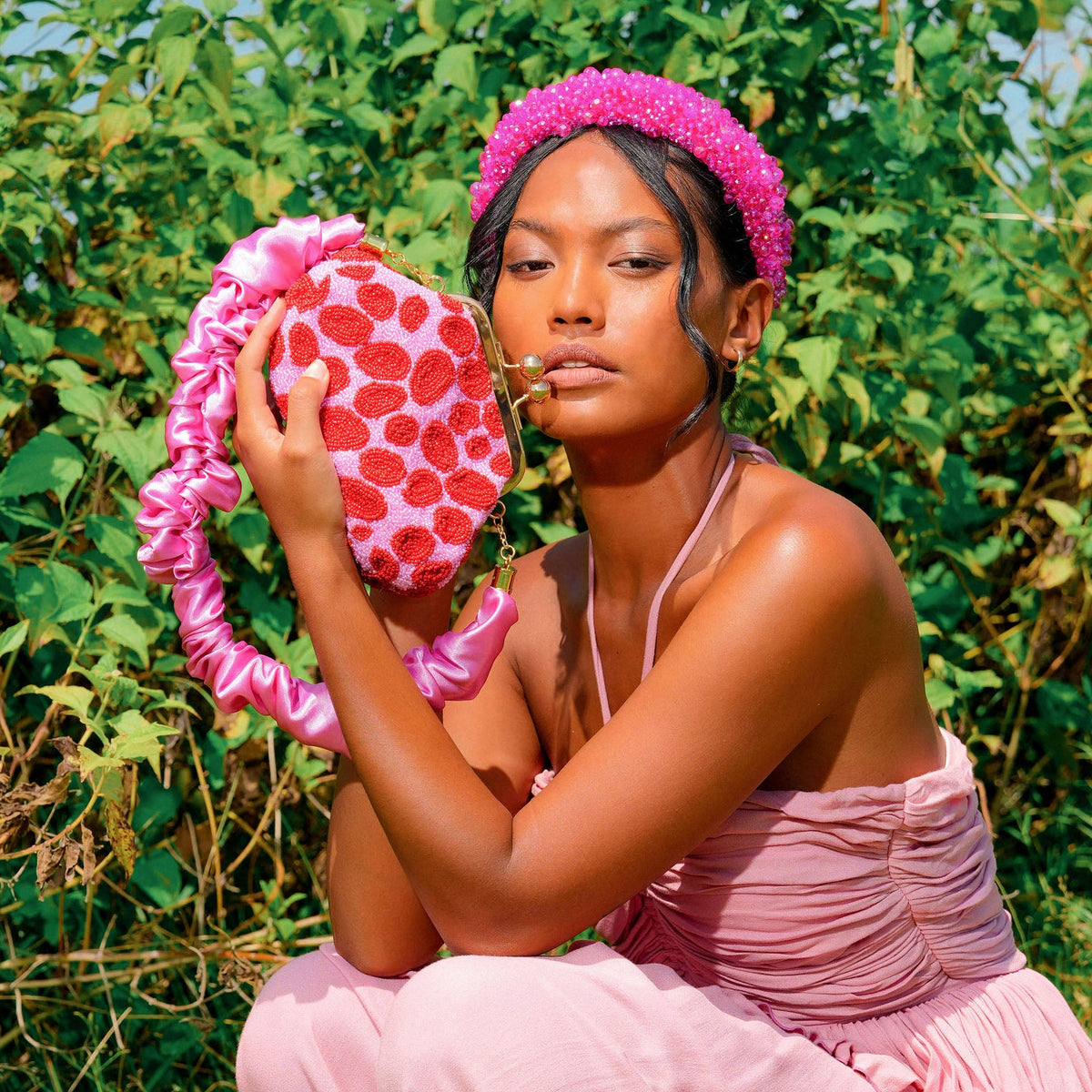 The Arnoldi Daisy Hand-Beaded Clutch in Pink & Red
