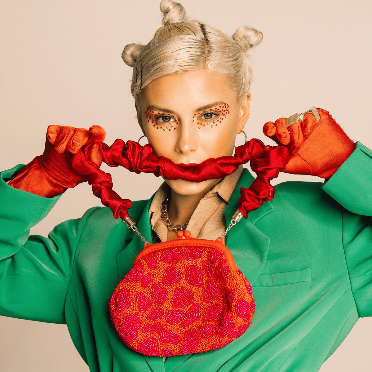 The Arnoldi Jean Hand-Beaded Clutch in Red & Pink