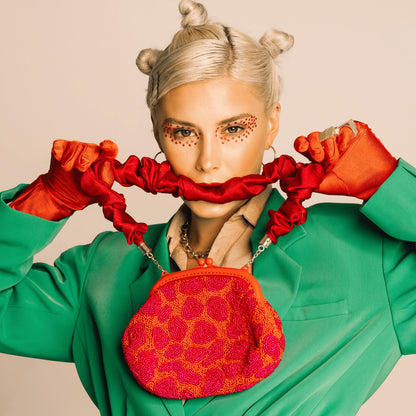 The Arnoldi Jean Hand-Beaded Clutch in Red & Pink