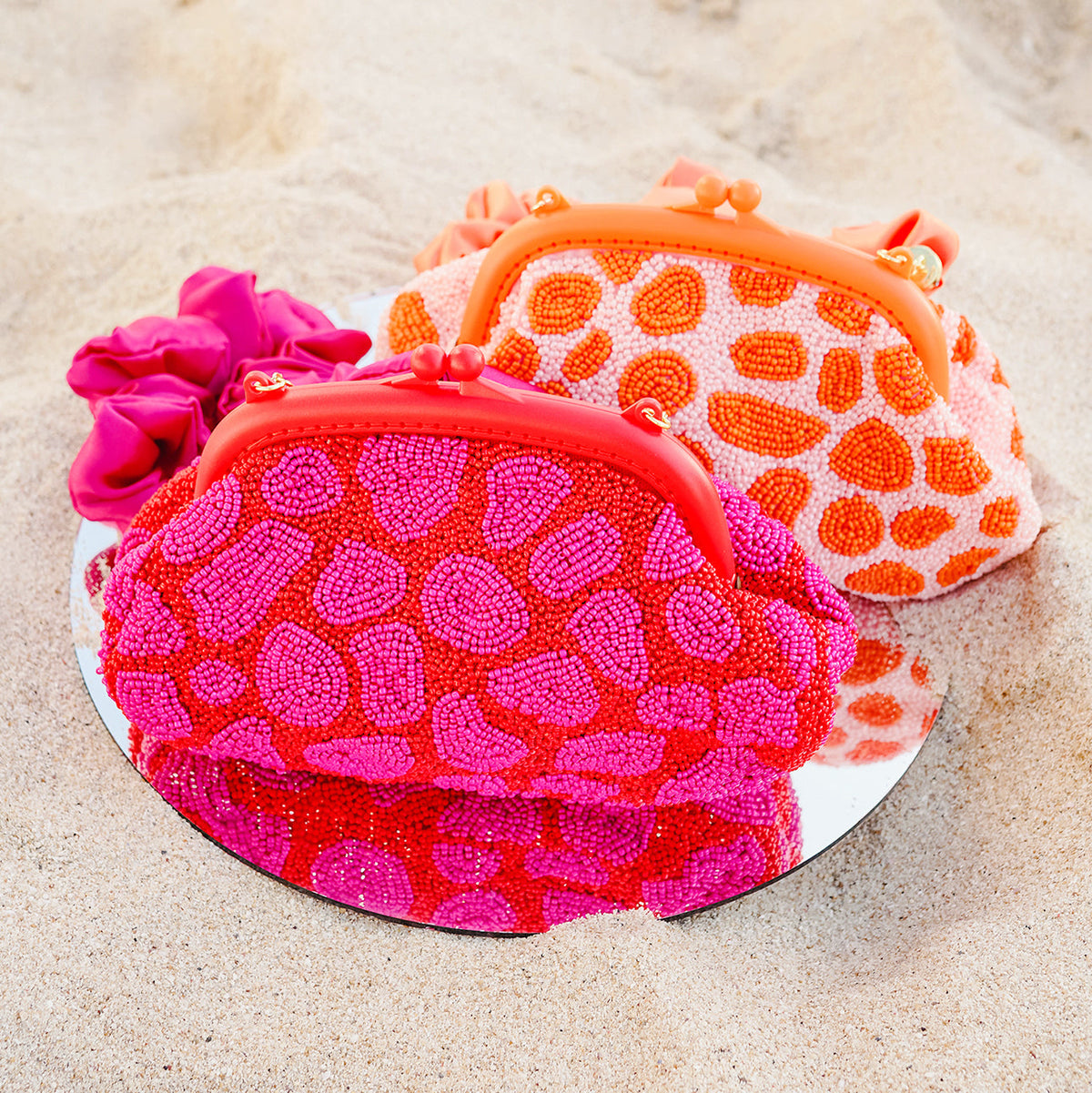 The Arnoldi Jean Hand-Beaded Clutch in Red & Pink