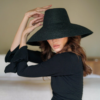 The Riri Jute Handwoven Straw Hat in Black
