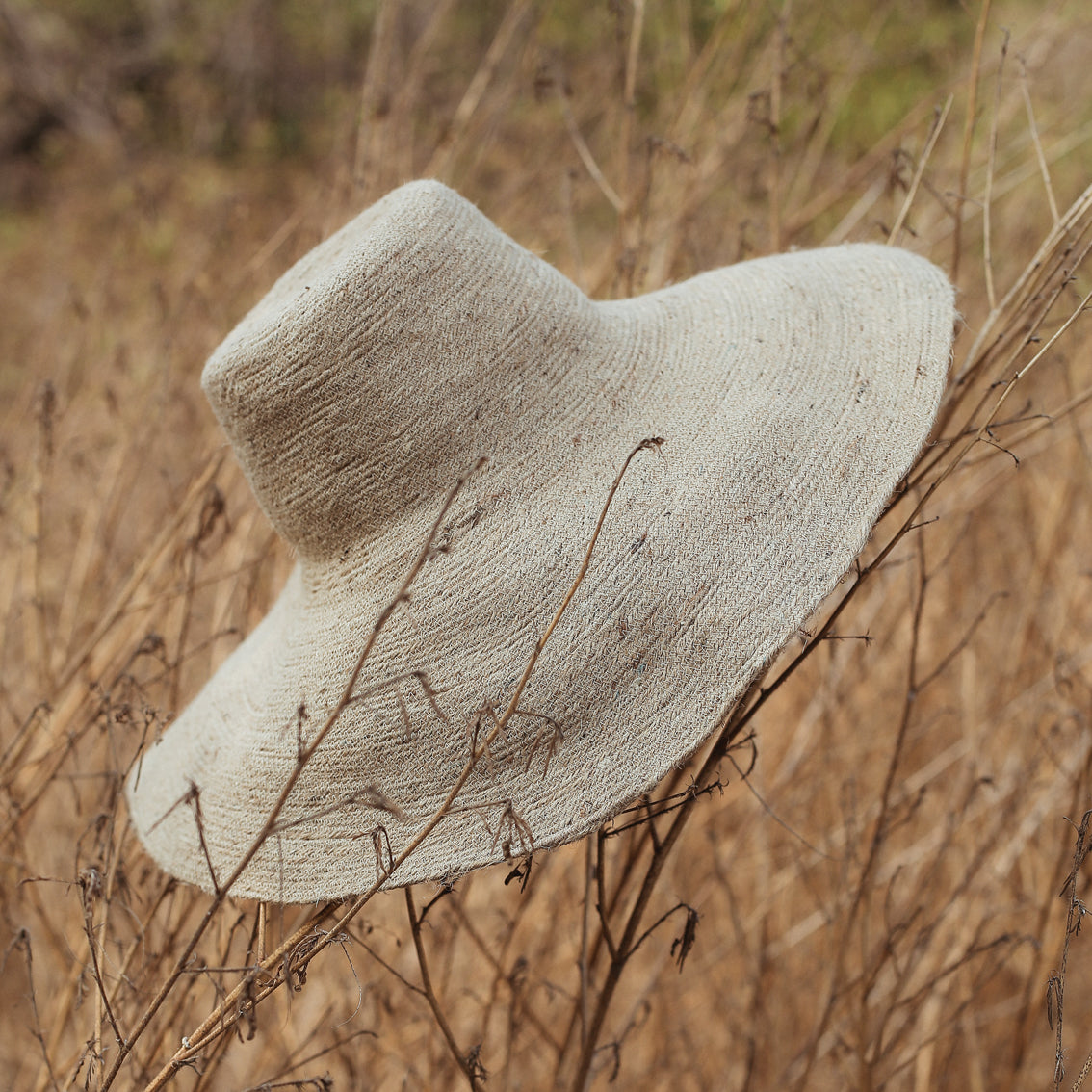 The Riri Jute Handwoven Straw Hat in Beige