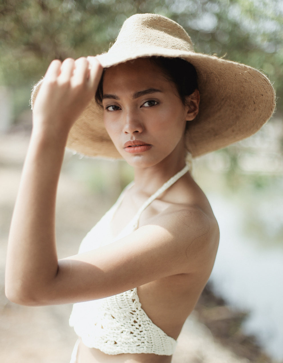 The Riri Jute Handwoven Straw Hat in Beige