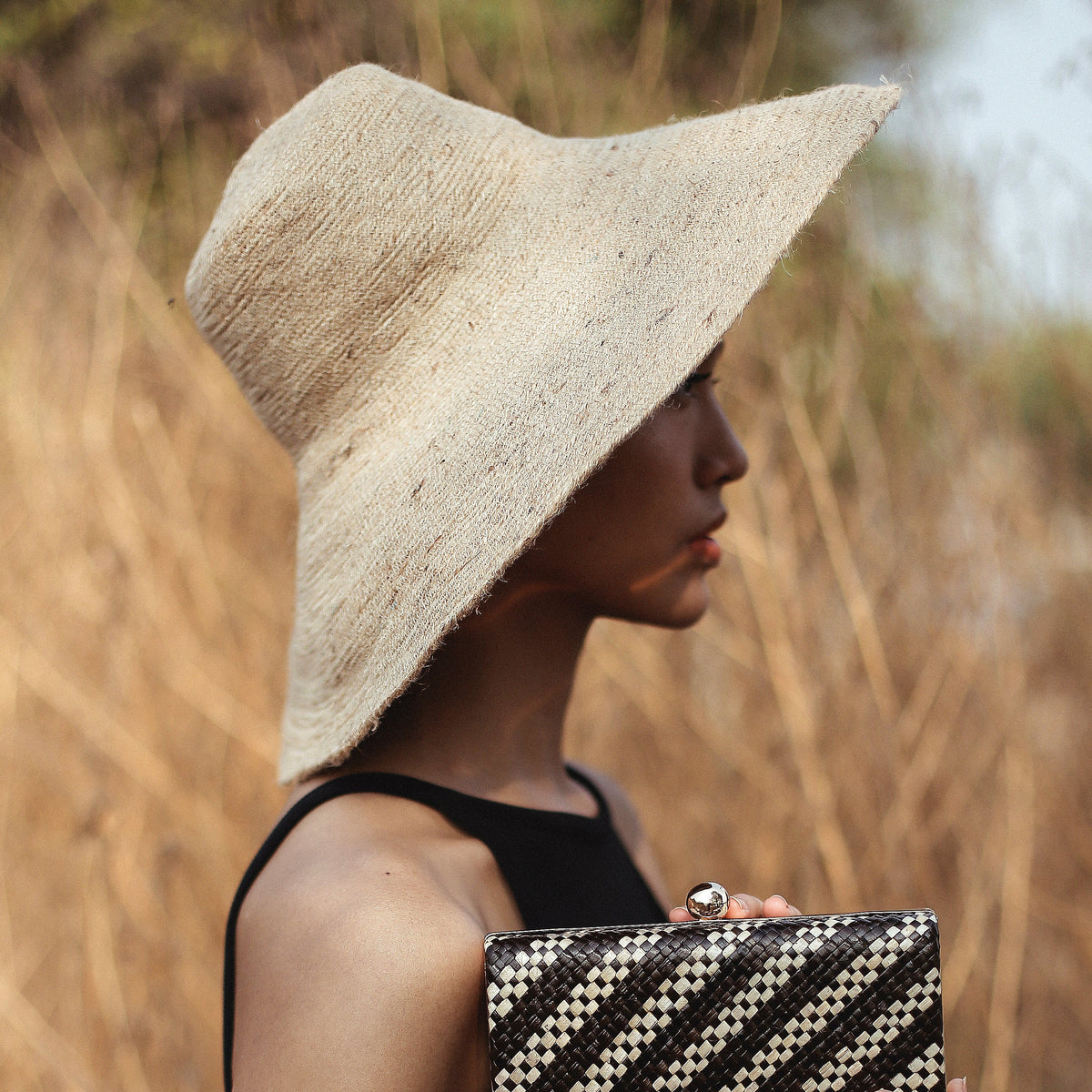 The Riri Jute Handwoven Straw Hat in Beige