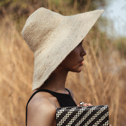 The Riri Jute Handwoven Straw Hat in Beige
