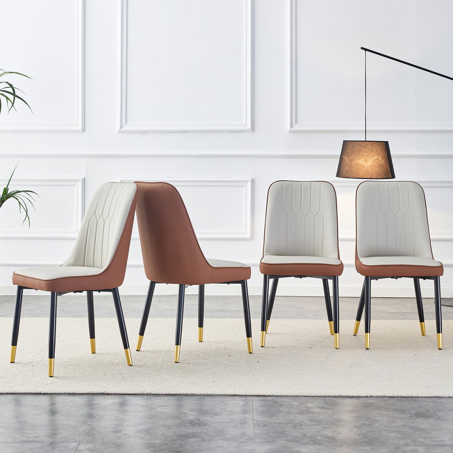 A modern dining chair with a light gray brown dual tone PU leather backrest and black metal legs, suitable for kitchens, bedrooms, and offices. Set of 4 pieces (light gray+brown+PU)C-007 W1151138283